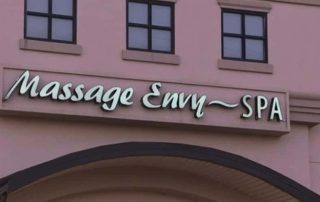 Massage Envy Spa signe on a pink building