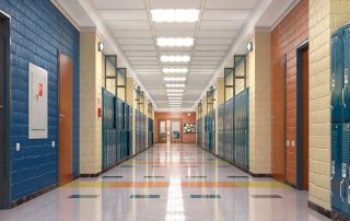 Empty hallway with lockers in a school