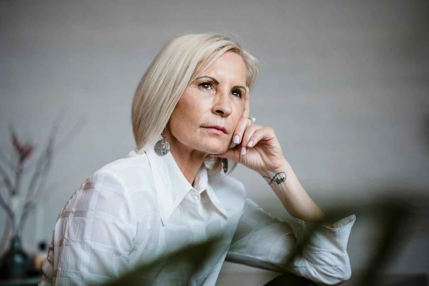 Mature woman deep in thought